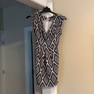 Dress. Zips in back. Ties above butt. Brand new